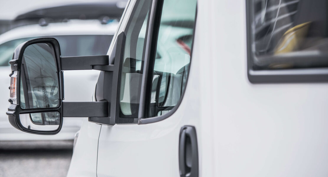 Close up view of the front passenger window of a motorhome